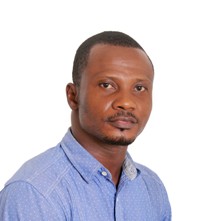 cyprian wearing a blue shirt
