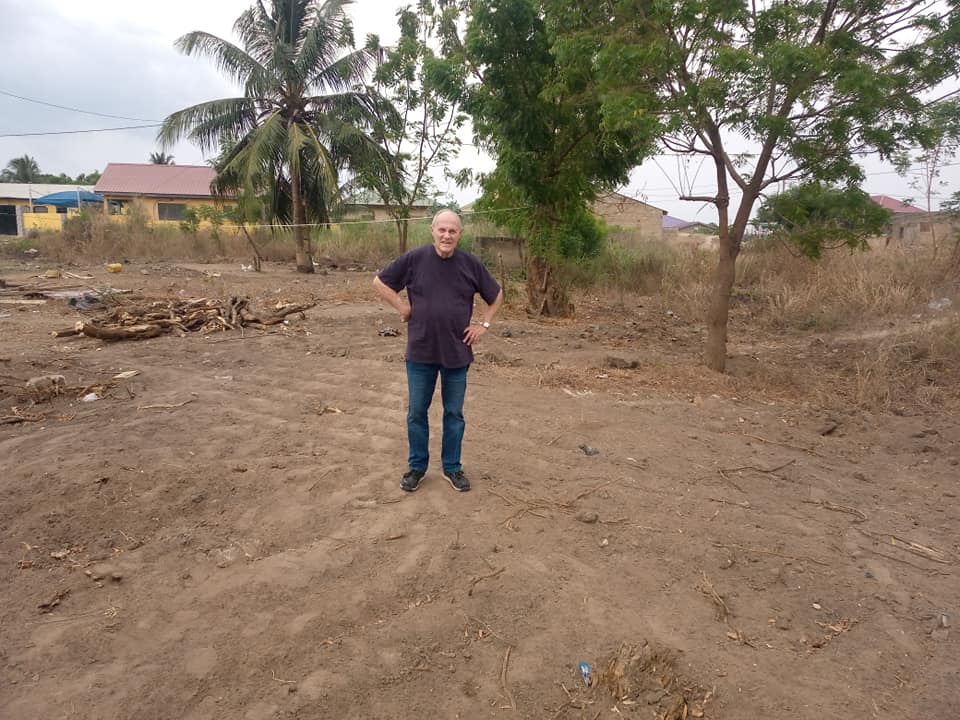 Dr. Dan standing on the purchased land