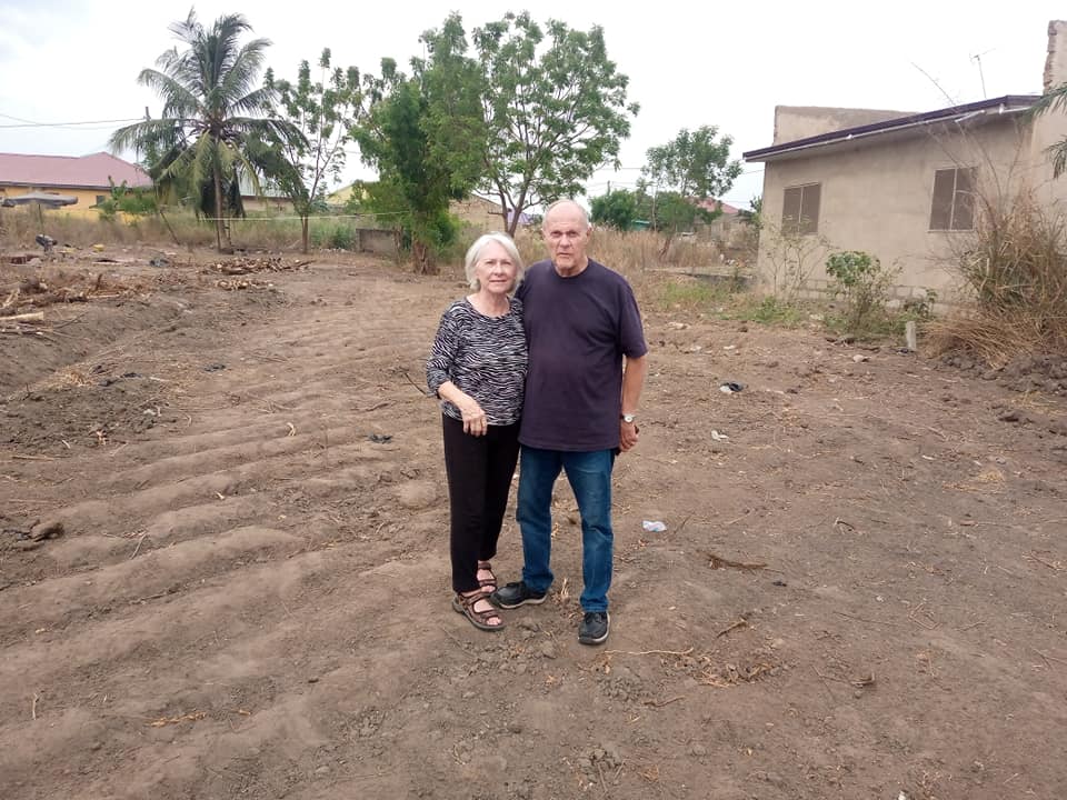 Dr. Dan and Pat Hill standing on the purchased land
