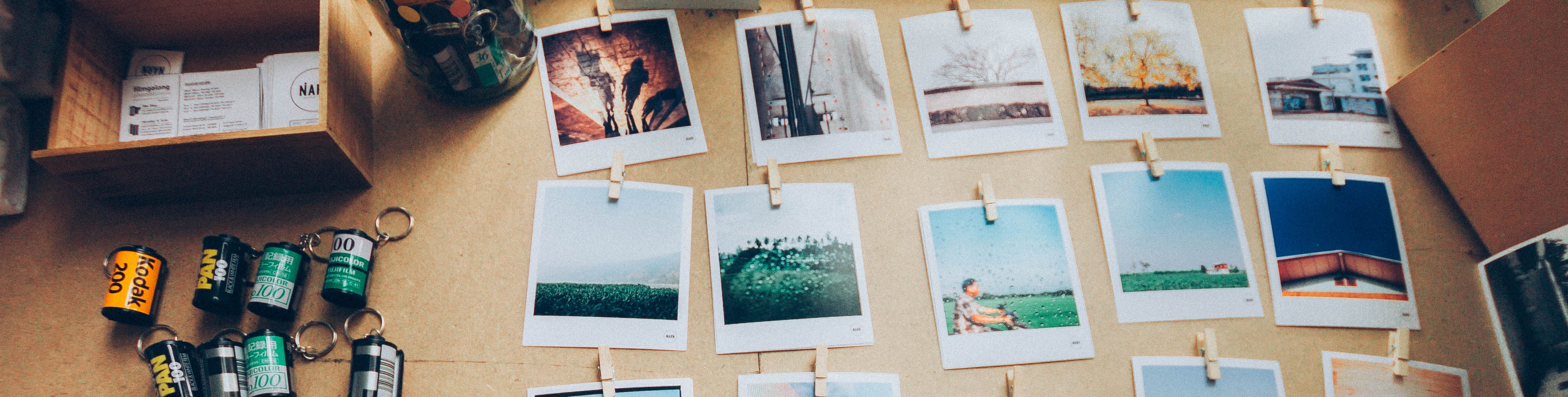 Assorted pictures on a wooden desk